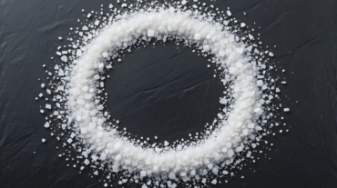 vecteezy_circle-of-salt-on-dark-slate-surface_73476365